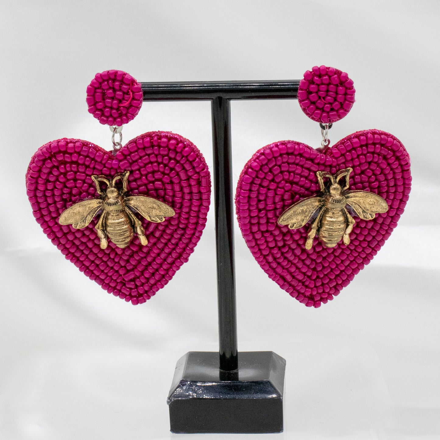 Aretes corazón magenta