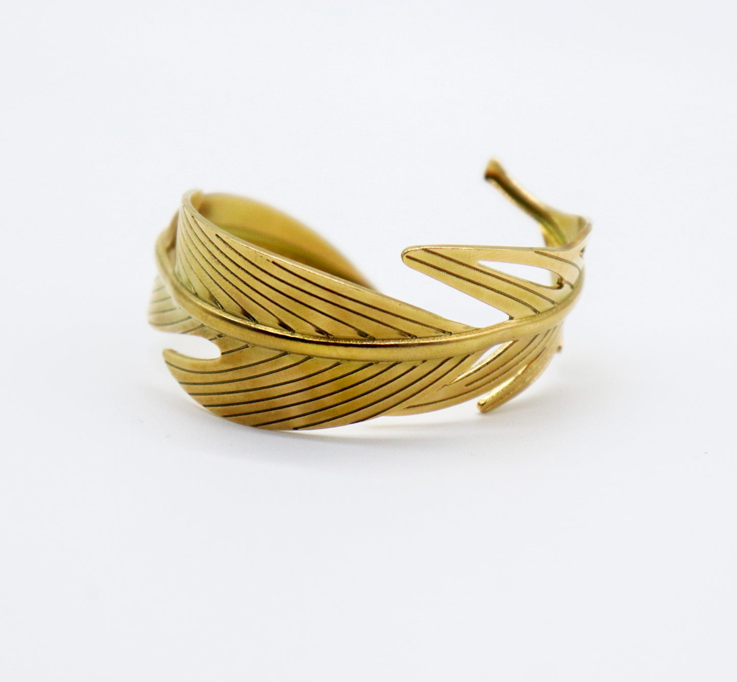 Brazalete pluma dorada